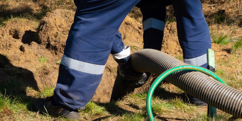 Man Pumping Septic Tank — Greenville, SC — American Waste Septic