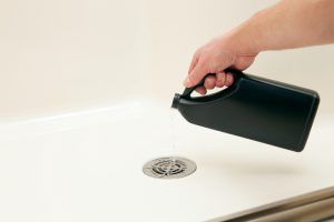 Man Hand Put Liquid in The Sink — Greenville, SC — American Waste Septic Man Hand Put Liquid in The Sink — Greenville, SC — American Waste Septic