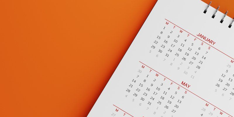 Calendar on Orange Background — Greenville, SC — American Waste Septic Calendar on Orange Background — Greenville, SC — American Waste Septic