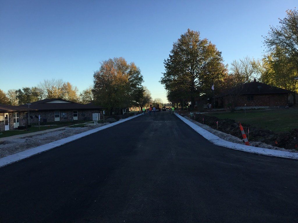 Asphalted Road — Skid Loader in Lincoln, MO