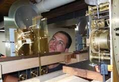 Repair — Clock Repair and Restoration in Lansdale, PA A man demonstrating clock repair services near Holland, PA