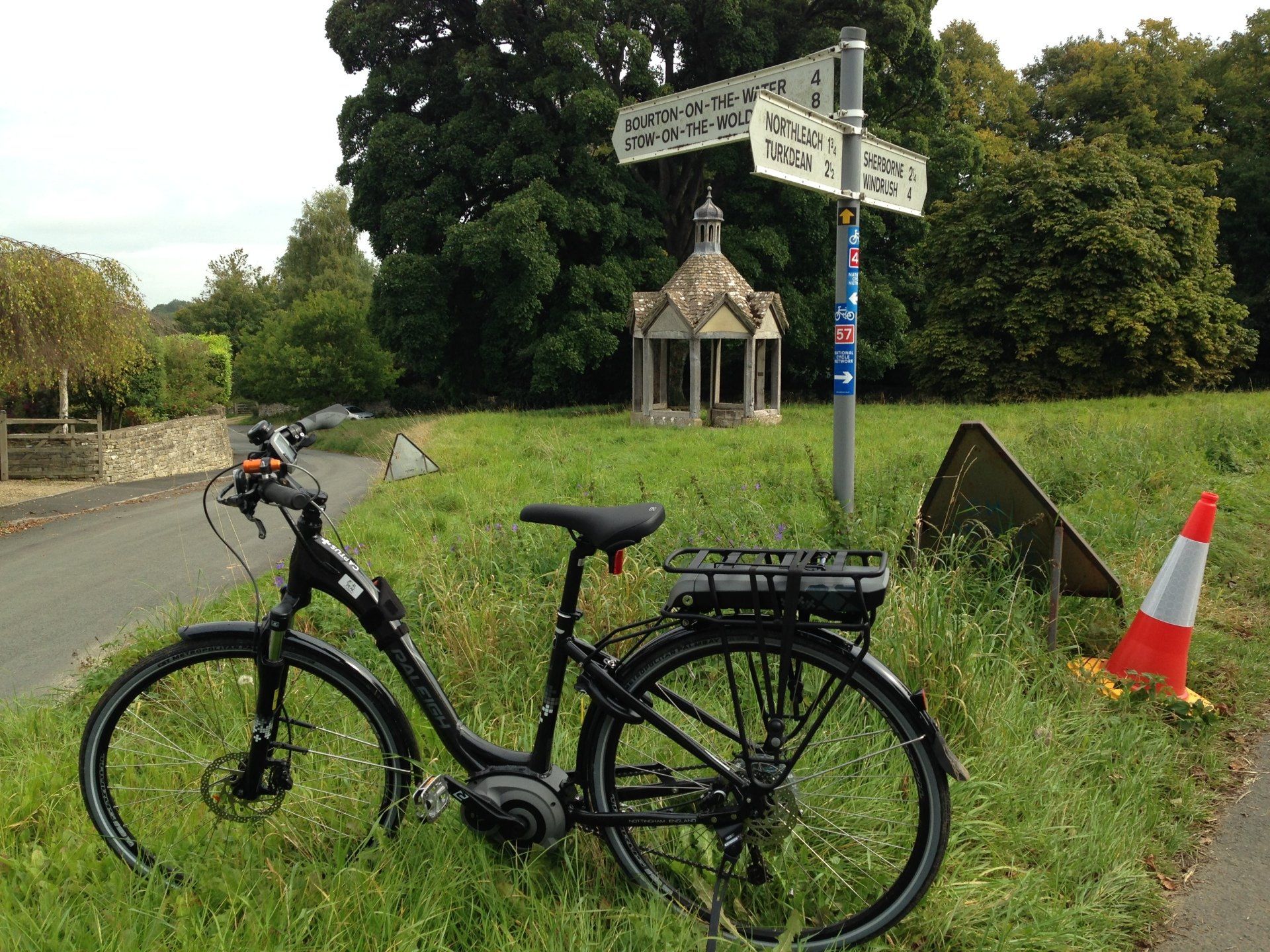 An electric bike is parked on the side of the road