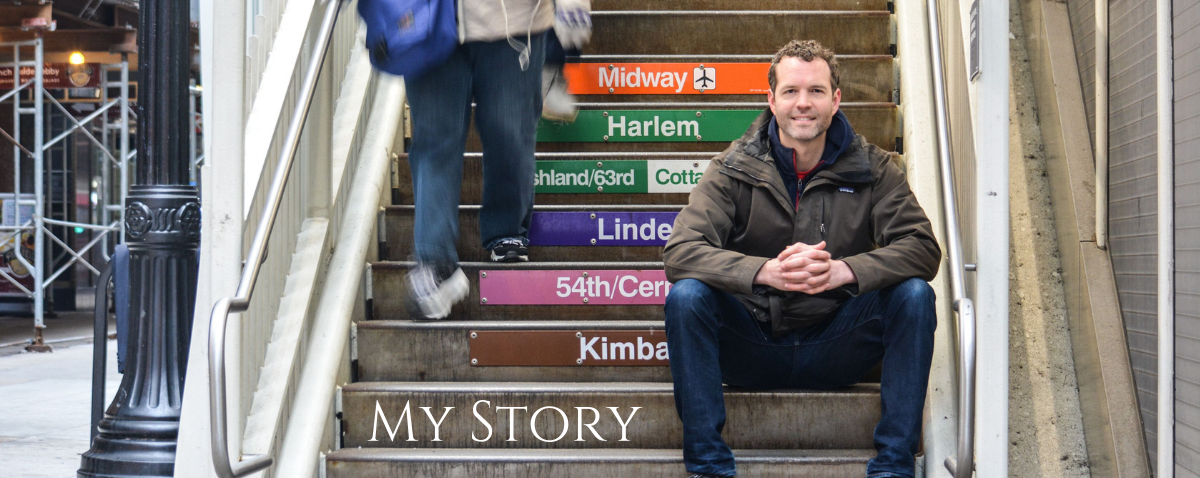 A man sits on a set of stairs that say my story