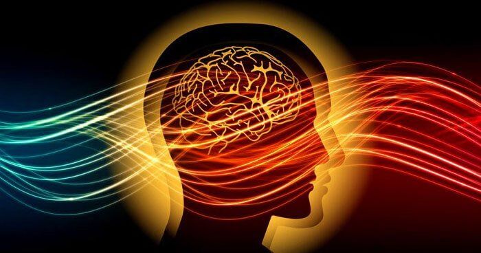 A silhouette of a person 's head with a brain and waves coming out of it.