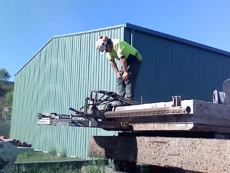man watching wall sawing