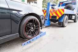 Tow Truck Towing a Broken Down Car — Towing Service in Ocean City, NJ Tow Truck Towing a Broken Down Car — Towing Service in Ocean City, NJ