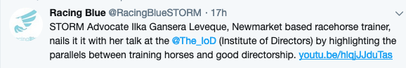 A blurred image of a tweet that says racing blue