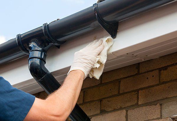 Man Wiping Fascia — Newark, OH — All American Weatherseal