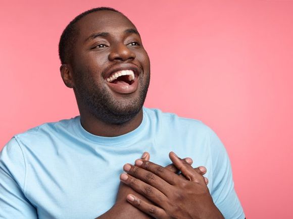 Black man holding his chest