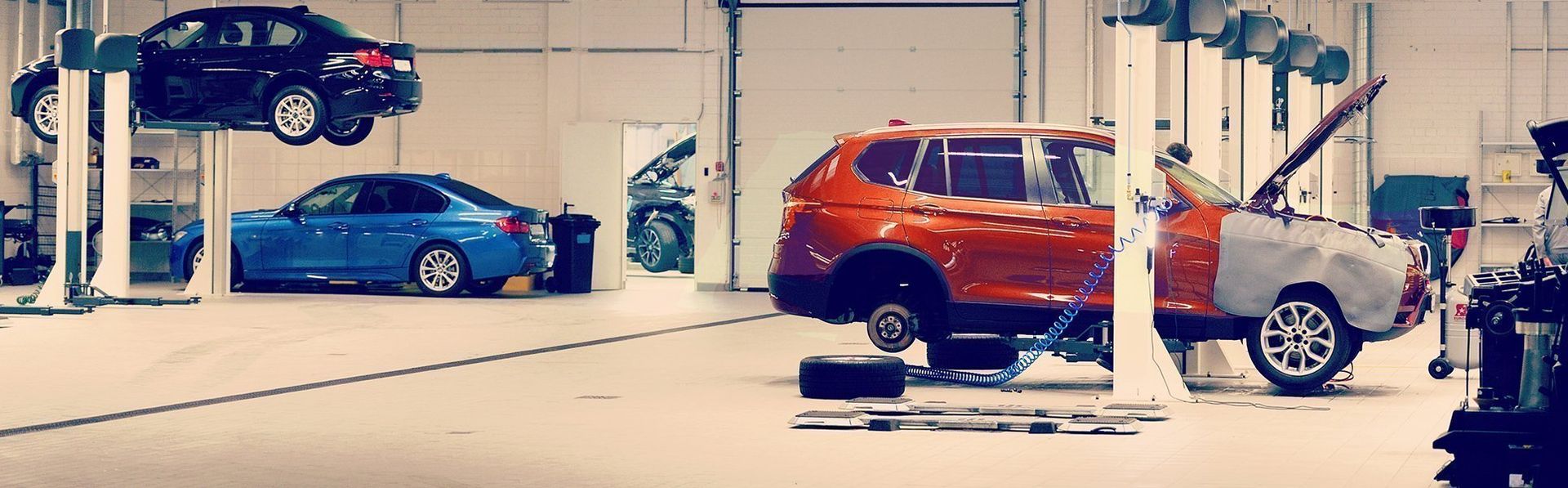 SUV in Shop With Tire Off