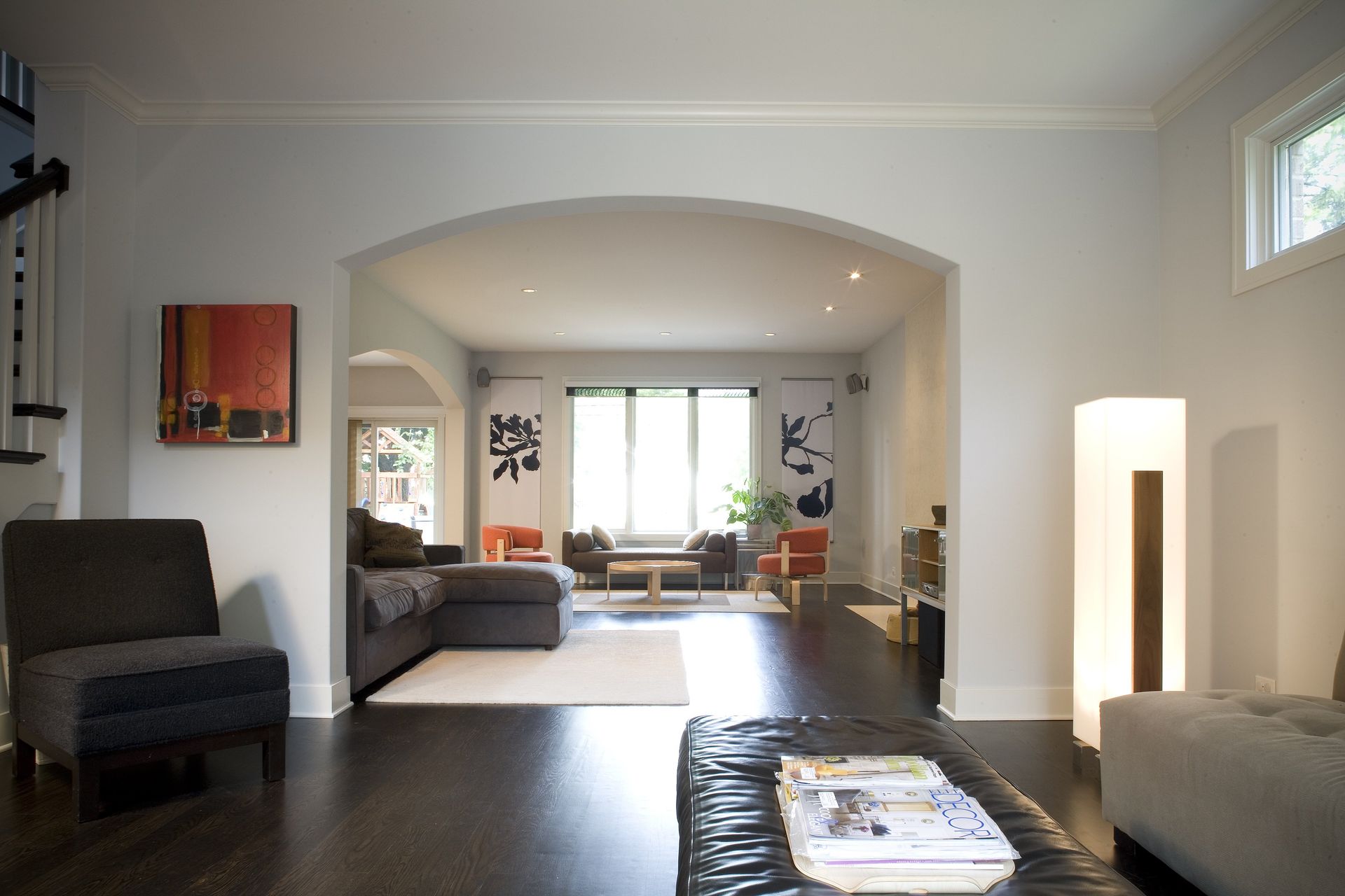 A living room with a couch and chairs and a table