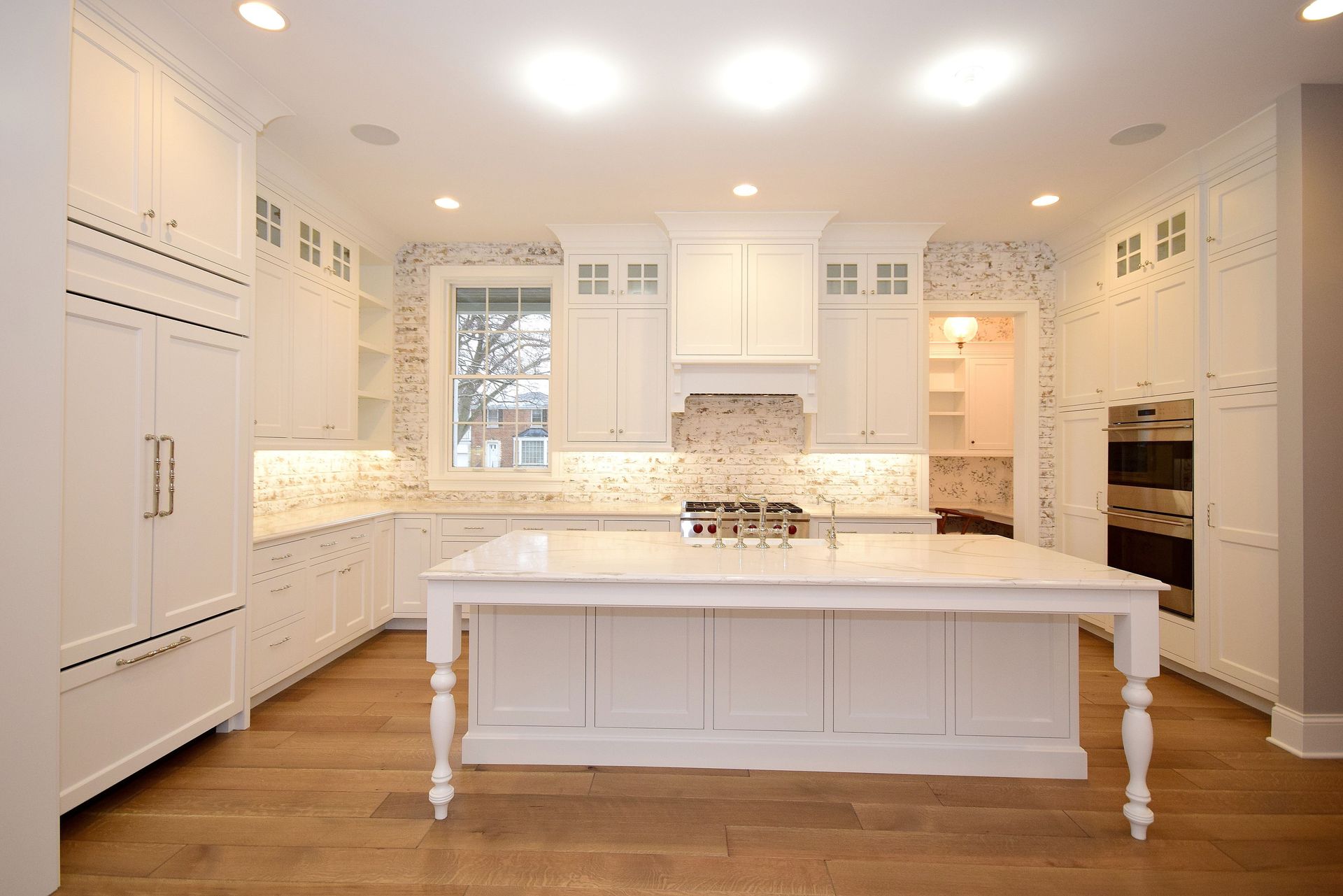 There is a large island in the middle of the kitchen.