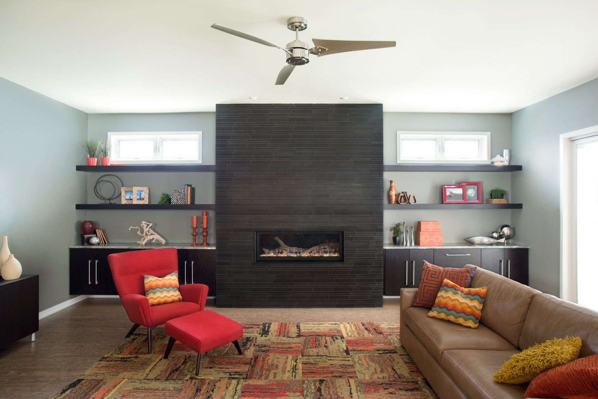 A living room with a couch , chair and fireplace