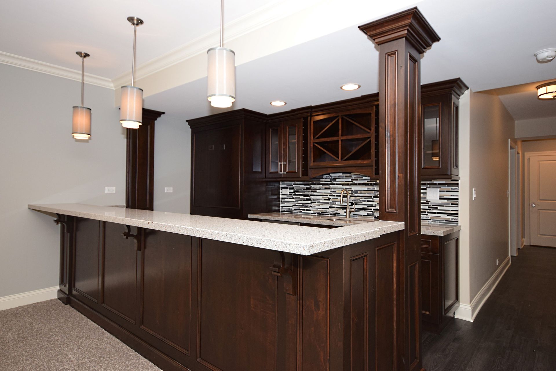 A kitchen with wooden cabinets and granite counter tops