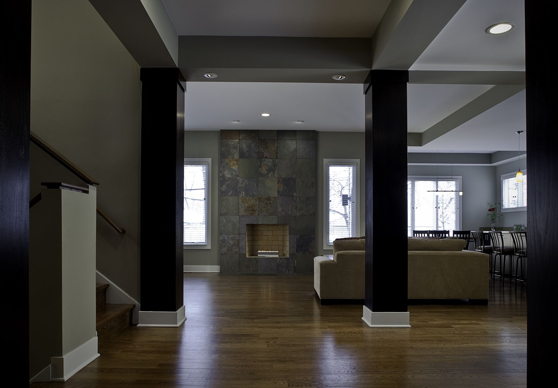 A living room with hardwood floors and a fireplace