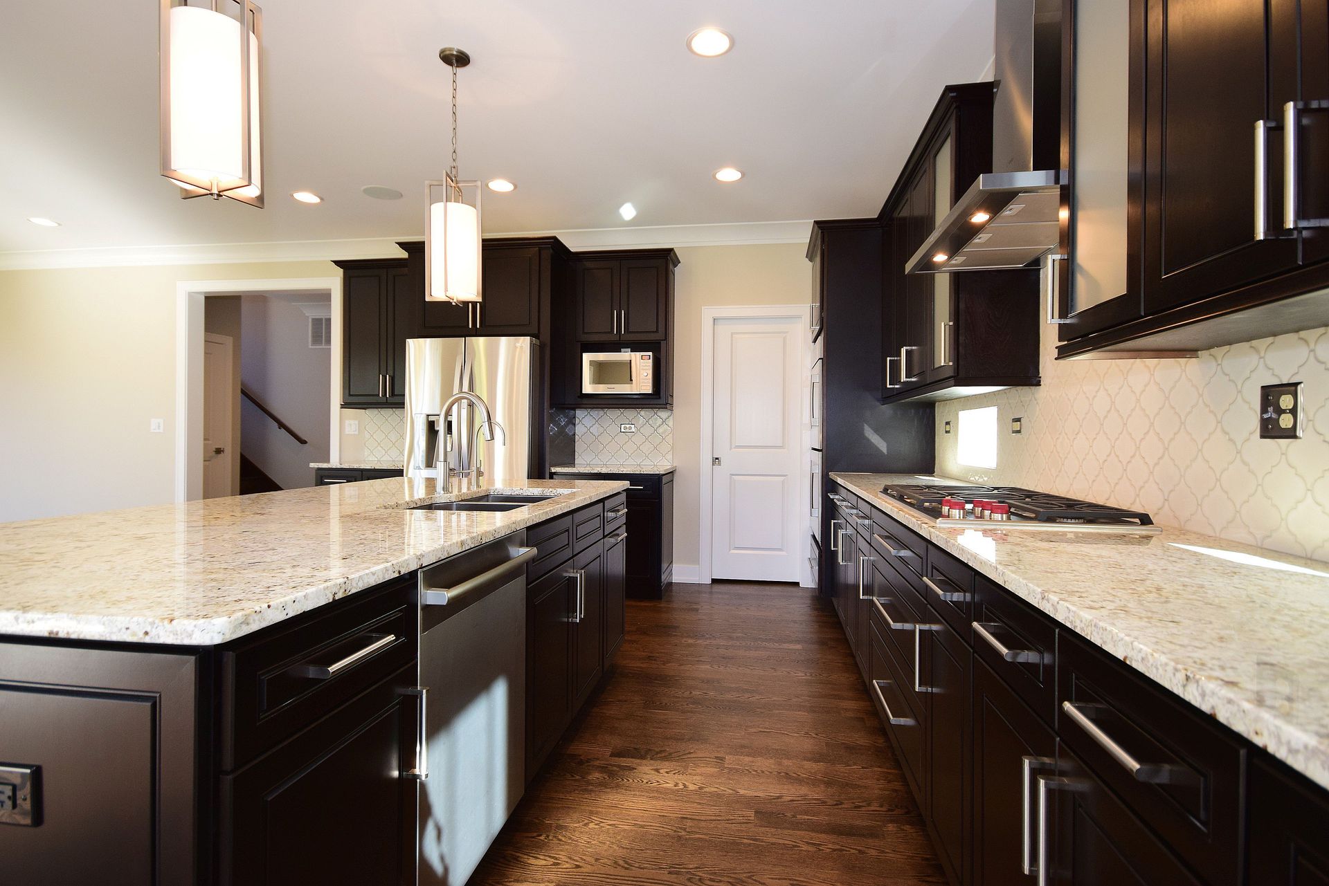 A kitchen with stainless steel appliances and granite counter tops