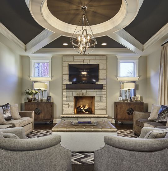 A living room with a fireplace and a flat screen tv