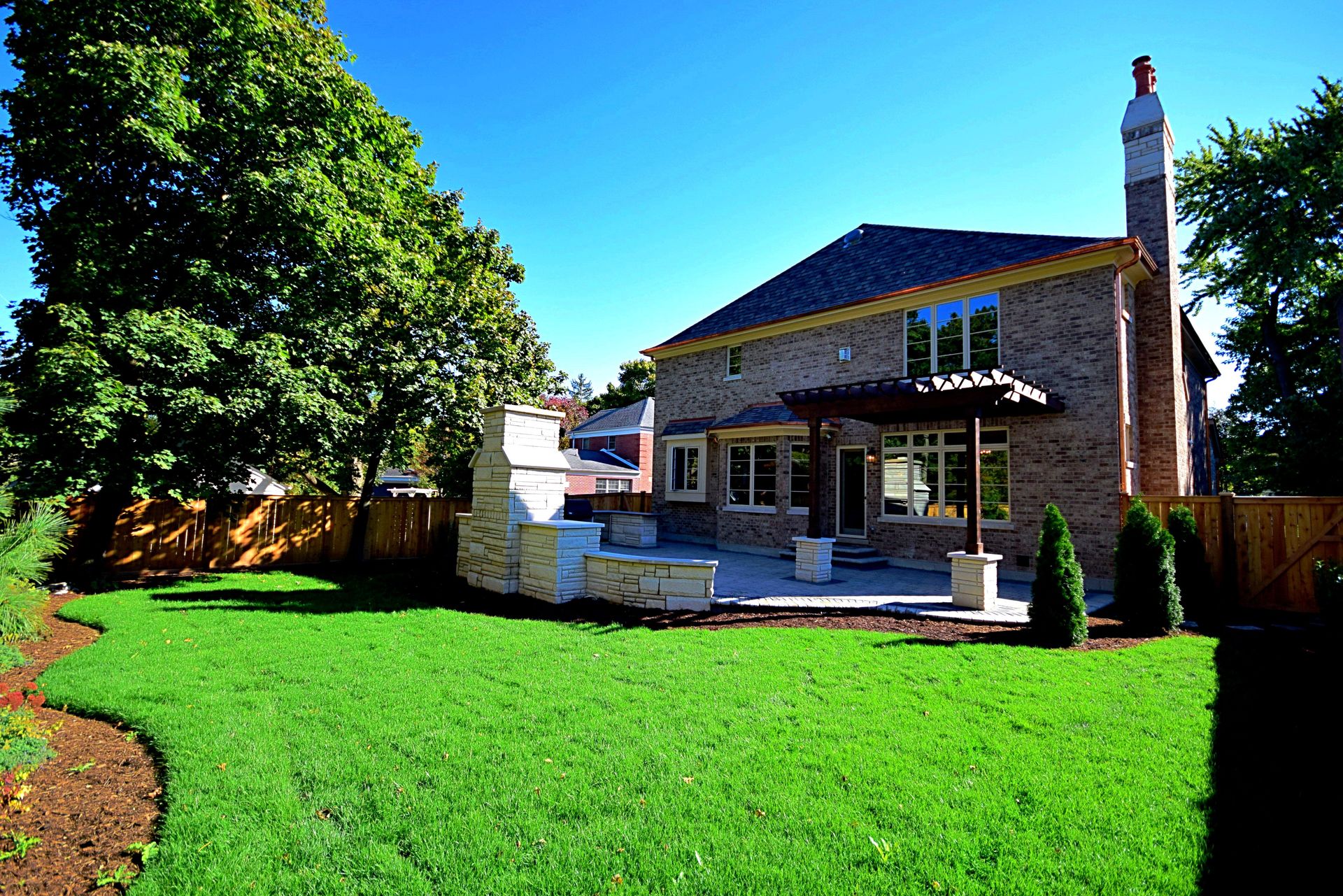 A large house with a large lawn in front of it