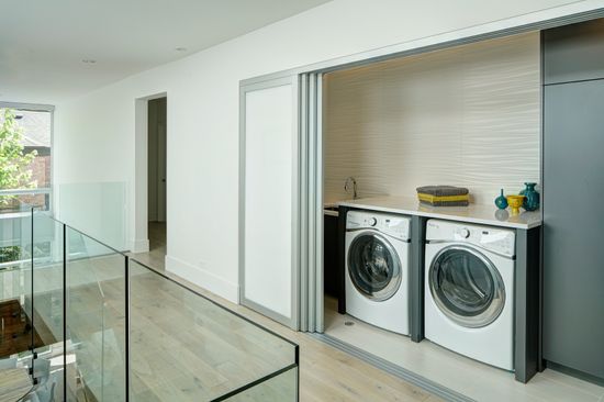 A laundry room with a washer and dryer in it.