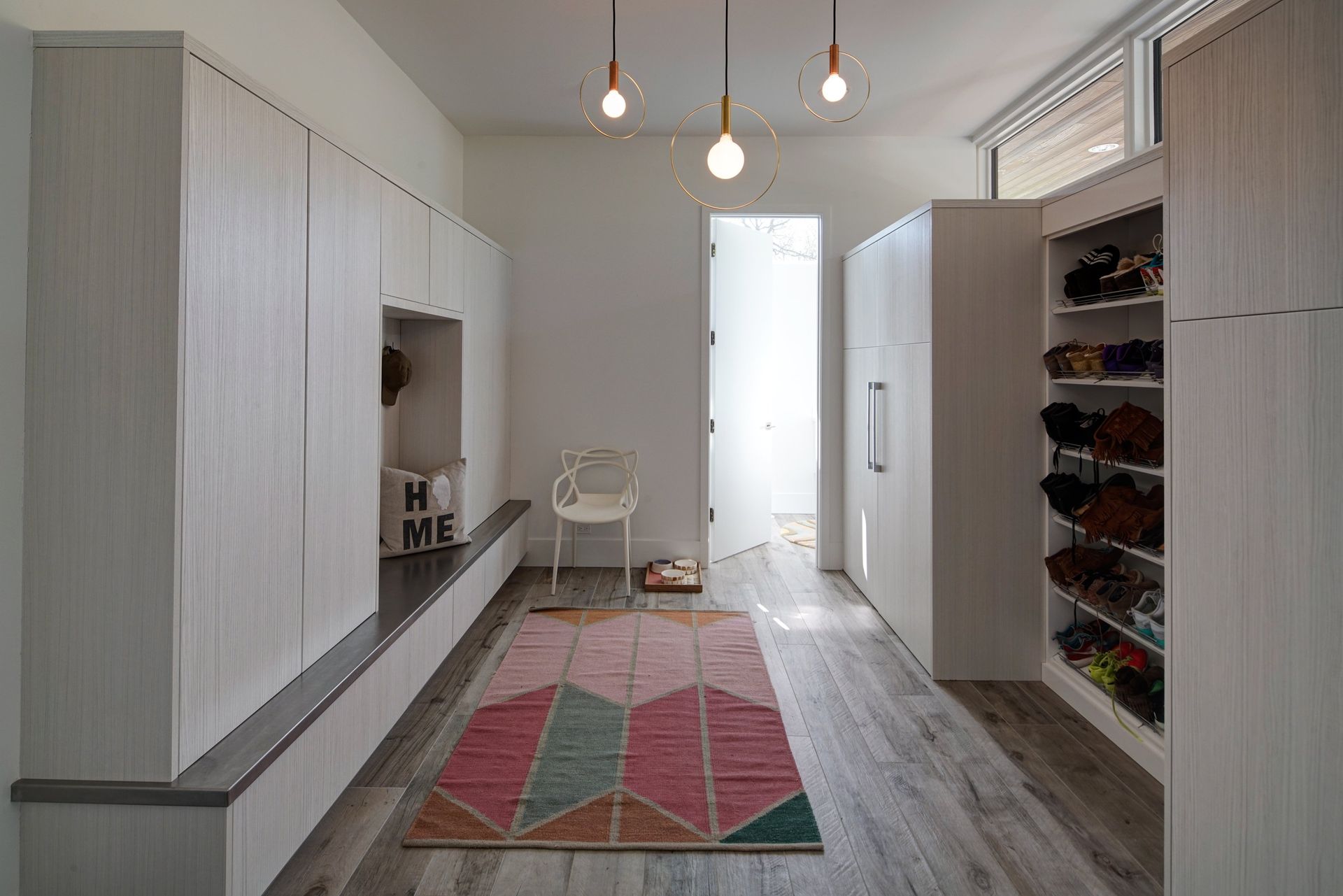 There is a rug on the floor in the middle of the room.