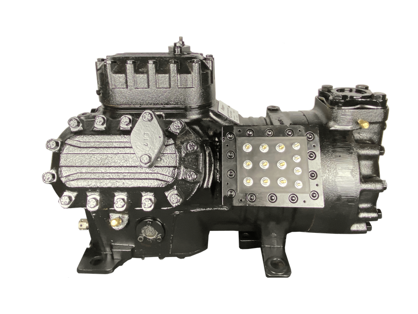 Industrial mechanical pump with black housing, silver fittings, and a yellow perforated plate on the side