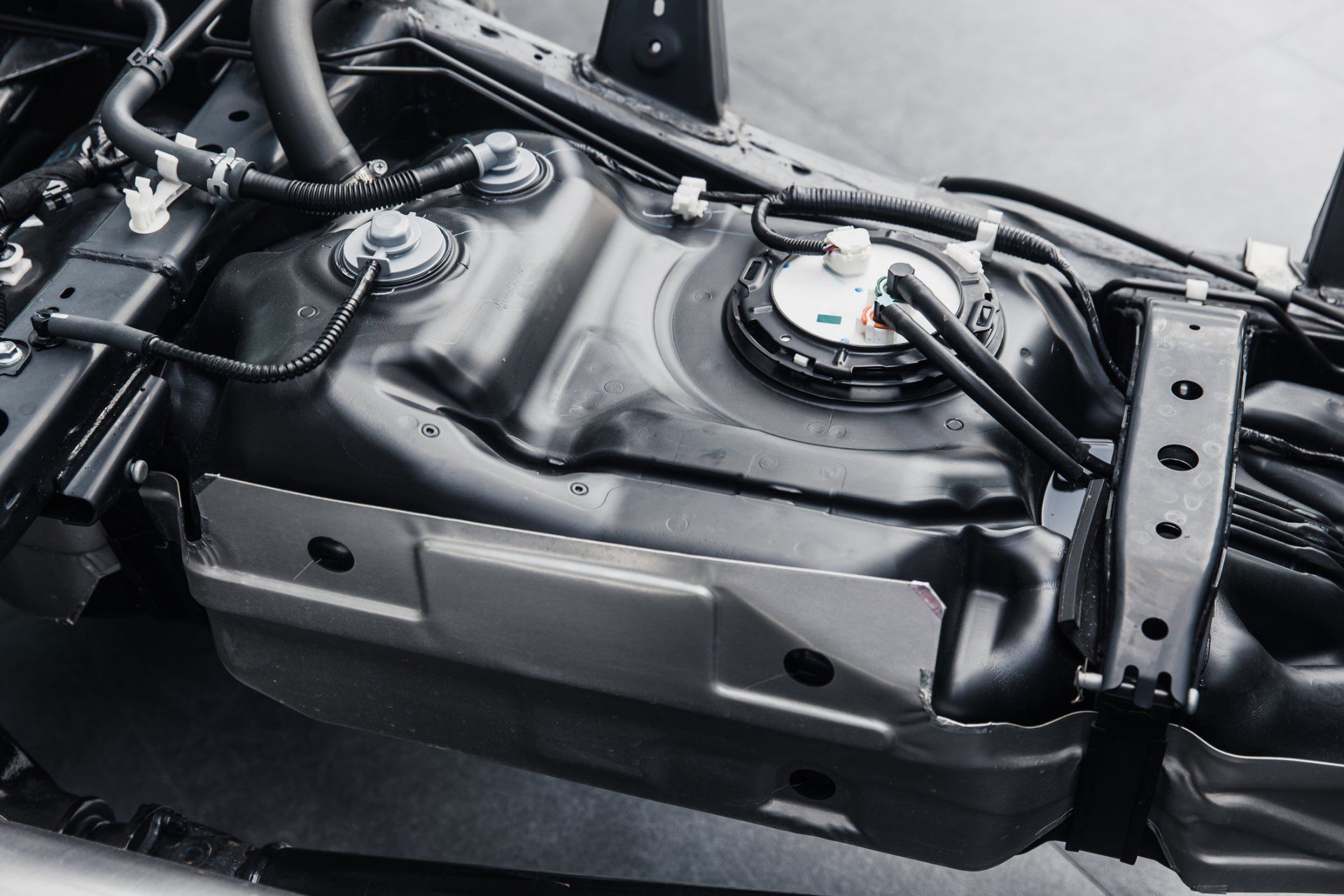 Windshield Repair — fuel tank inside car chassis underbody clean new from factory in Warminster, PA Windshield Repair — fuel tank inside car chassis underbody clean new from factory in Warminster, PA