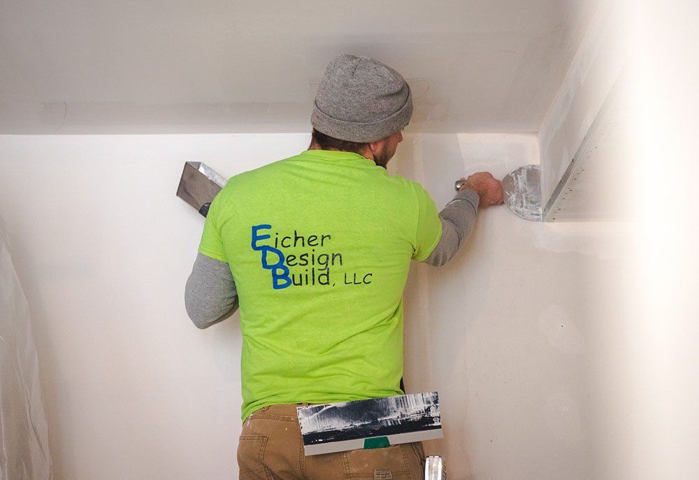 man fixing wall