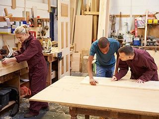Staff Working In Busy Carpentry Workshop — Beaumont, CA — Absolute Cabinets Inc Staff Working In Busy Carpentry Workshop — Beaumont, CA — Absolute Cabinets Inc