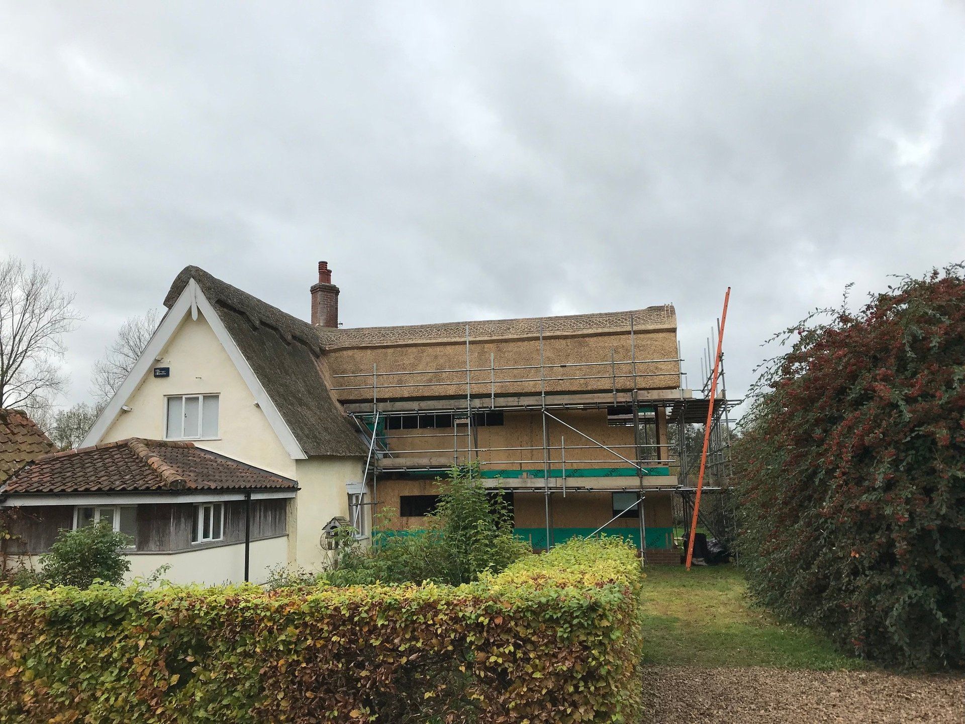 thatched roof being constructed