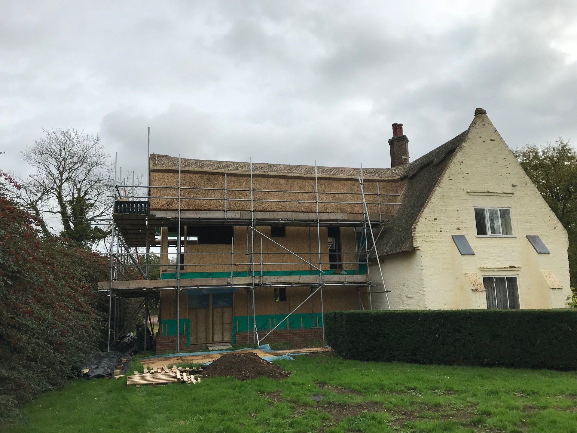 thatched roof being constructed