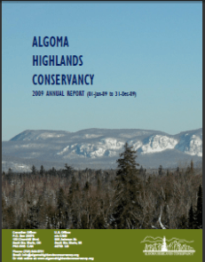 Algoma Highlands Conservancy annual report cover with blue sky and snowy mountains