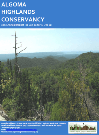 Algoma Highlands Conservancy annual report cover with forested hills under a blue sky