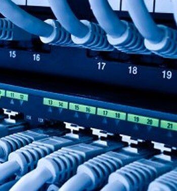 A bunch of cables are connected to a server.