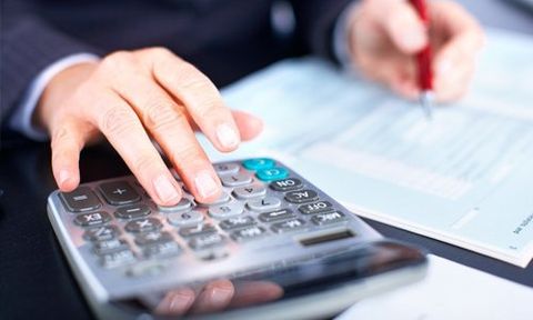 man using a calculator