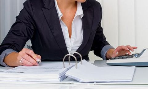 woman working on VAT calculations