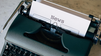 picture of a type writer with the word News on a piece of paper