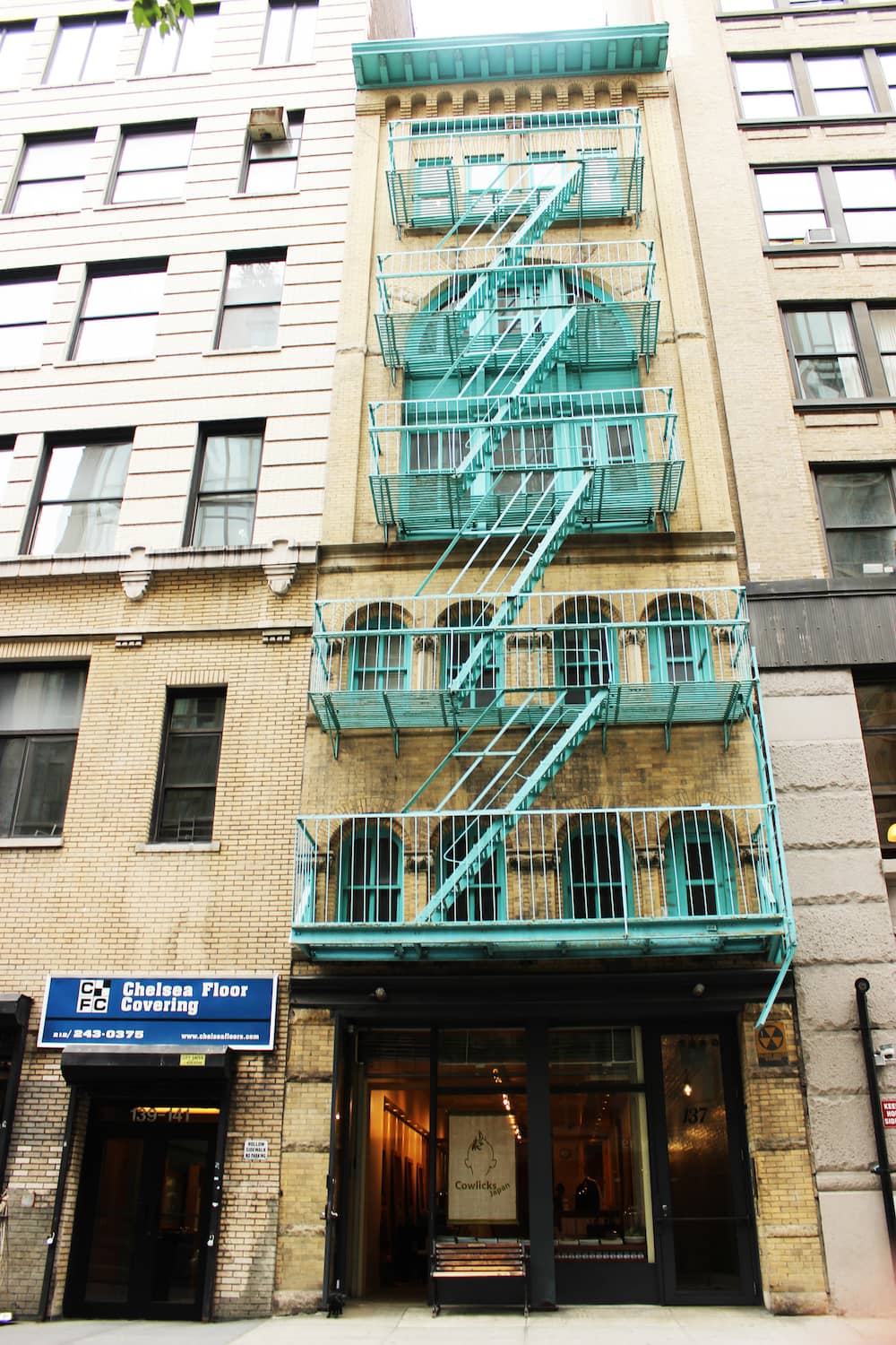Six-story residential building in Chelsea with turquoise trim
