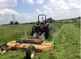 cutting grass as part of land clearing