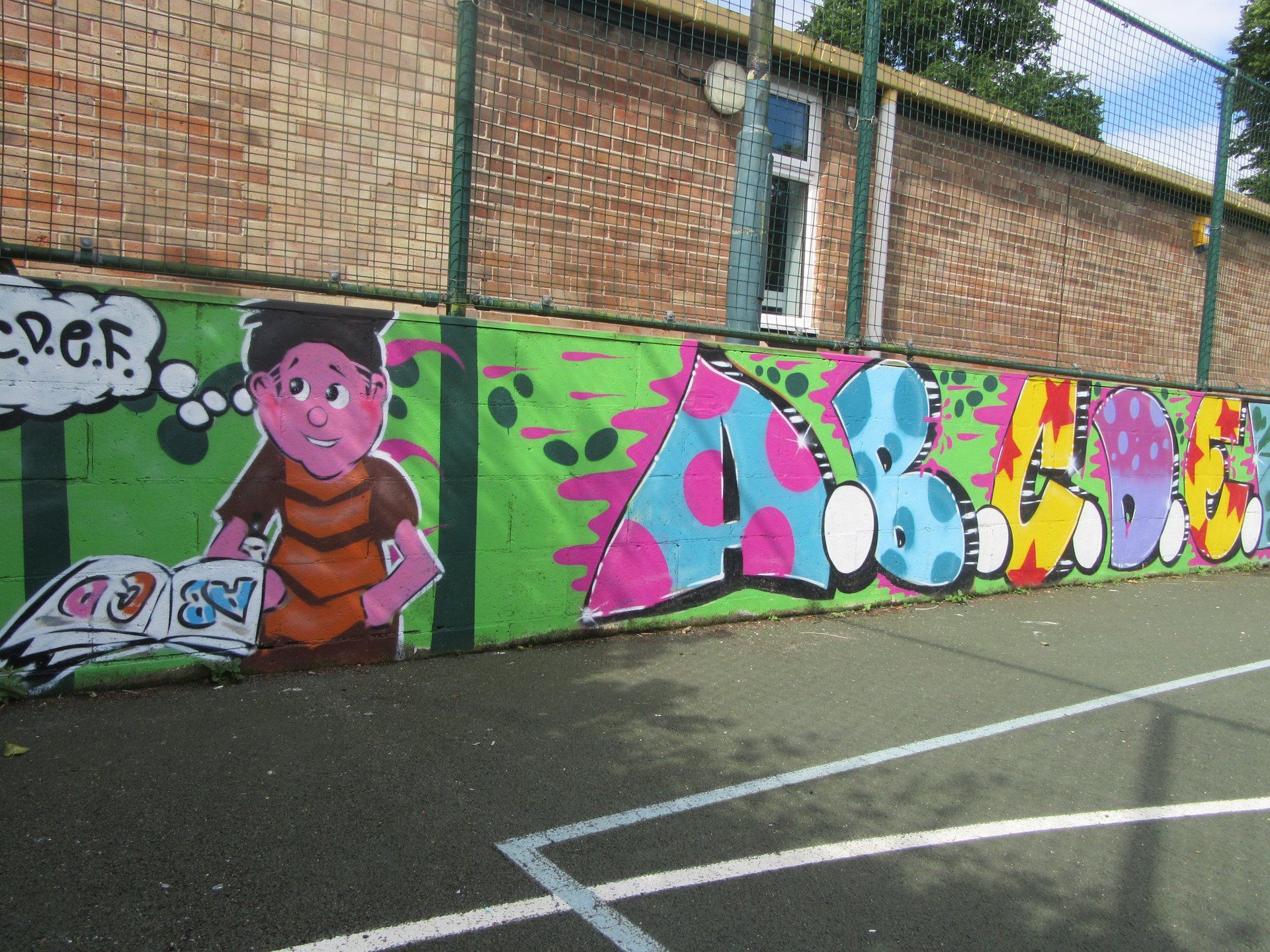Youth club ball court graffiti mural