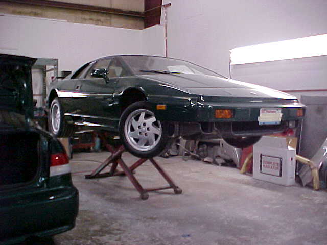 Car Service — Car lifted on Auto Hoist  in Redmond, WA