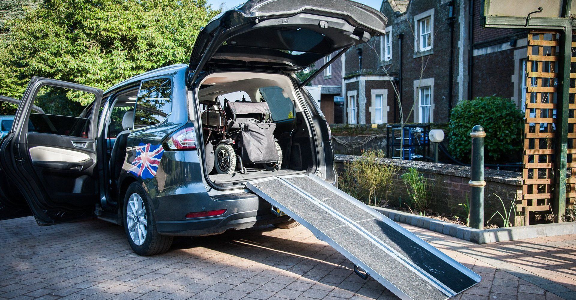 taxi with boot open and accessible ramp