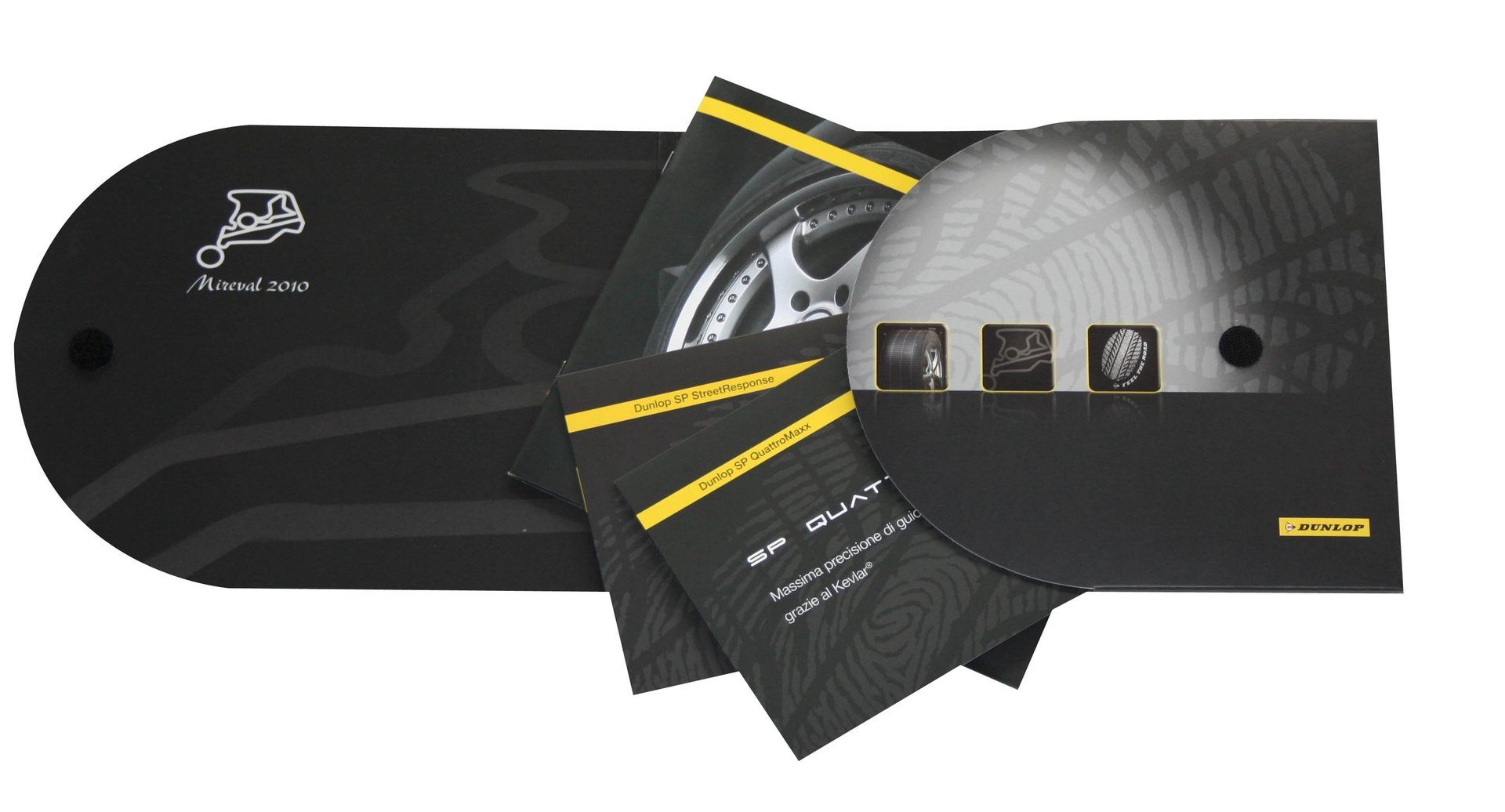Confezione promozionale nera con brochure, disco e foto della ruota.
