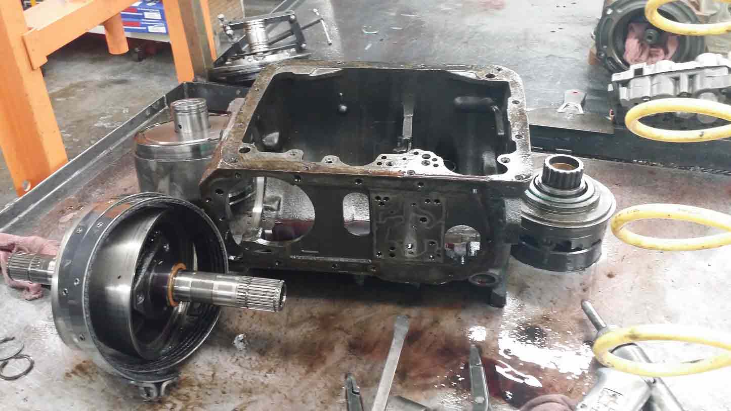 Step 03: The transmission is inspected for wear and damage.