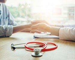 Doctor with Patient — Family Medical Clinic in Asheville,NC Doctor with Patient — Family Medical Clinic in Asheville,NC