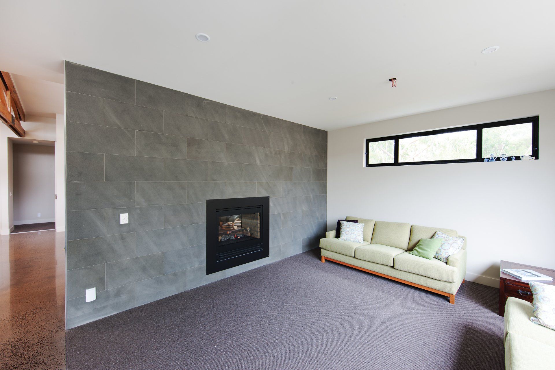 A living room with a fireplace and a couch