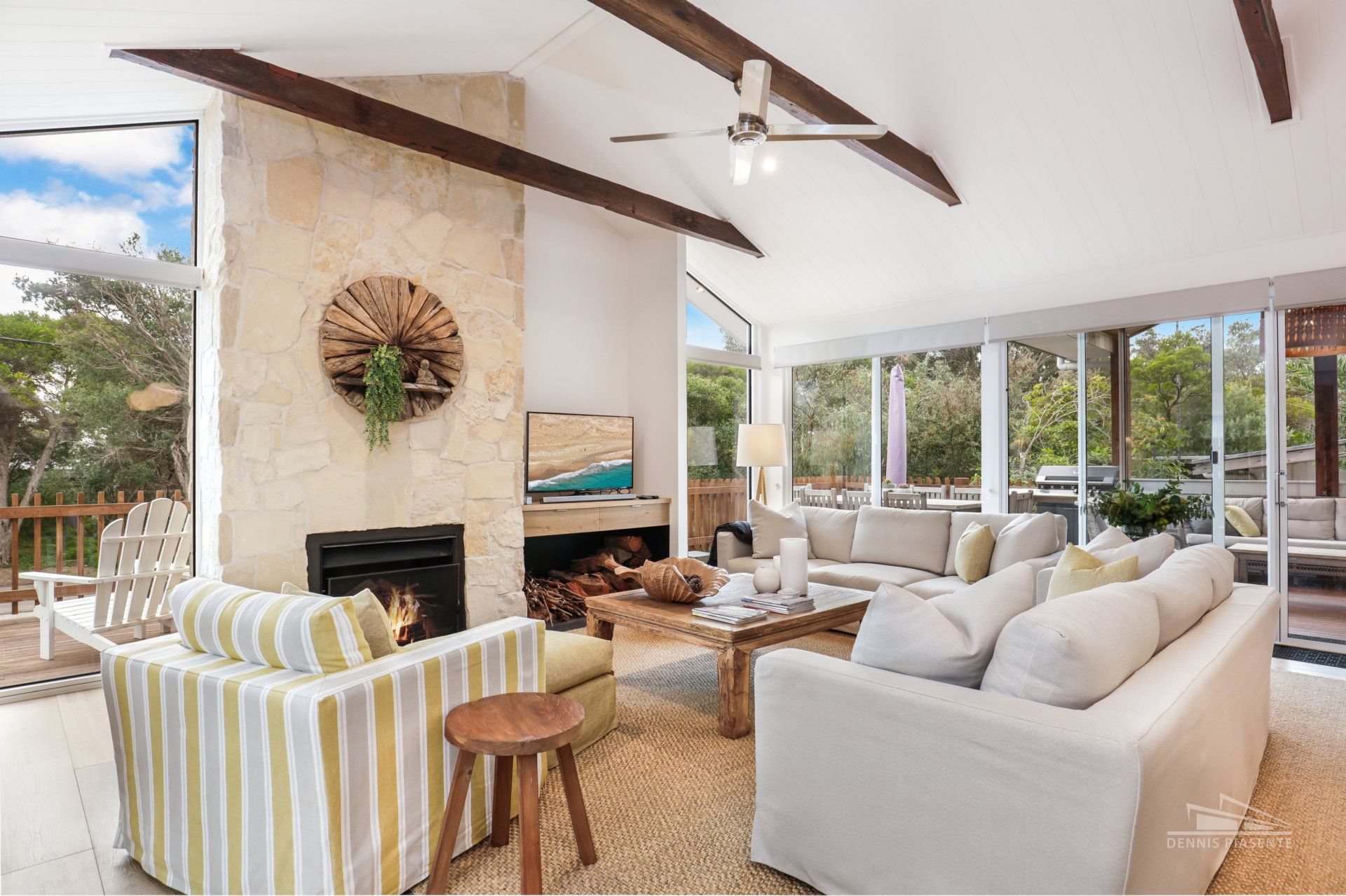 A living room filled with furniture and a fireplace.