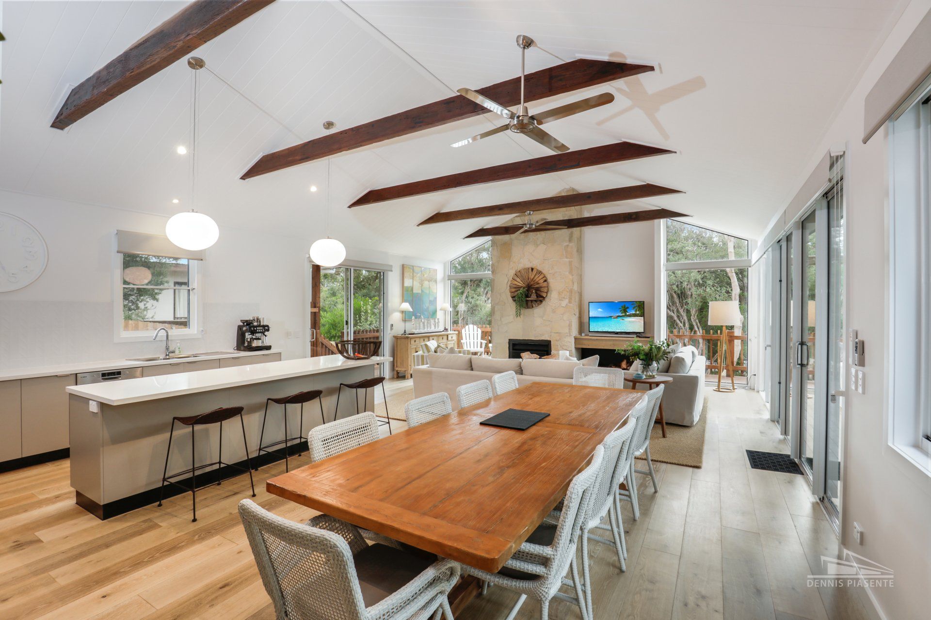 There is a large wooden table in the middle of the room.
