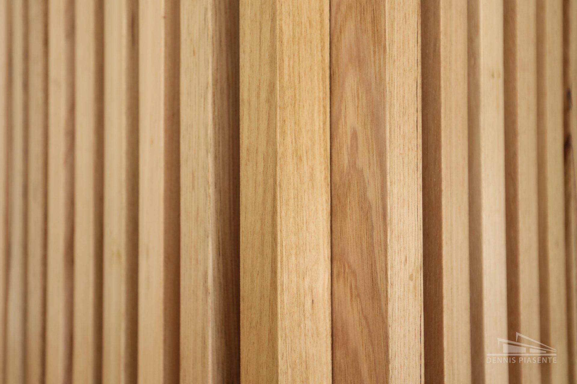 A close up of a wooden wall made of wooden slats.