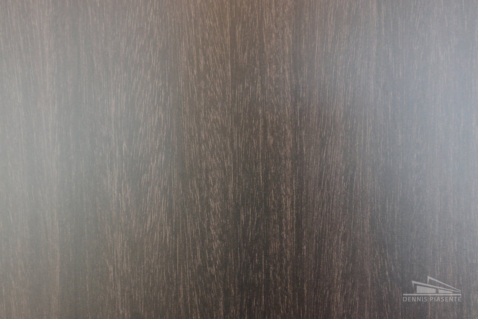 A close up of a piece of wood with a grainy texture.