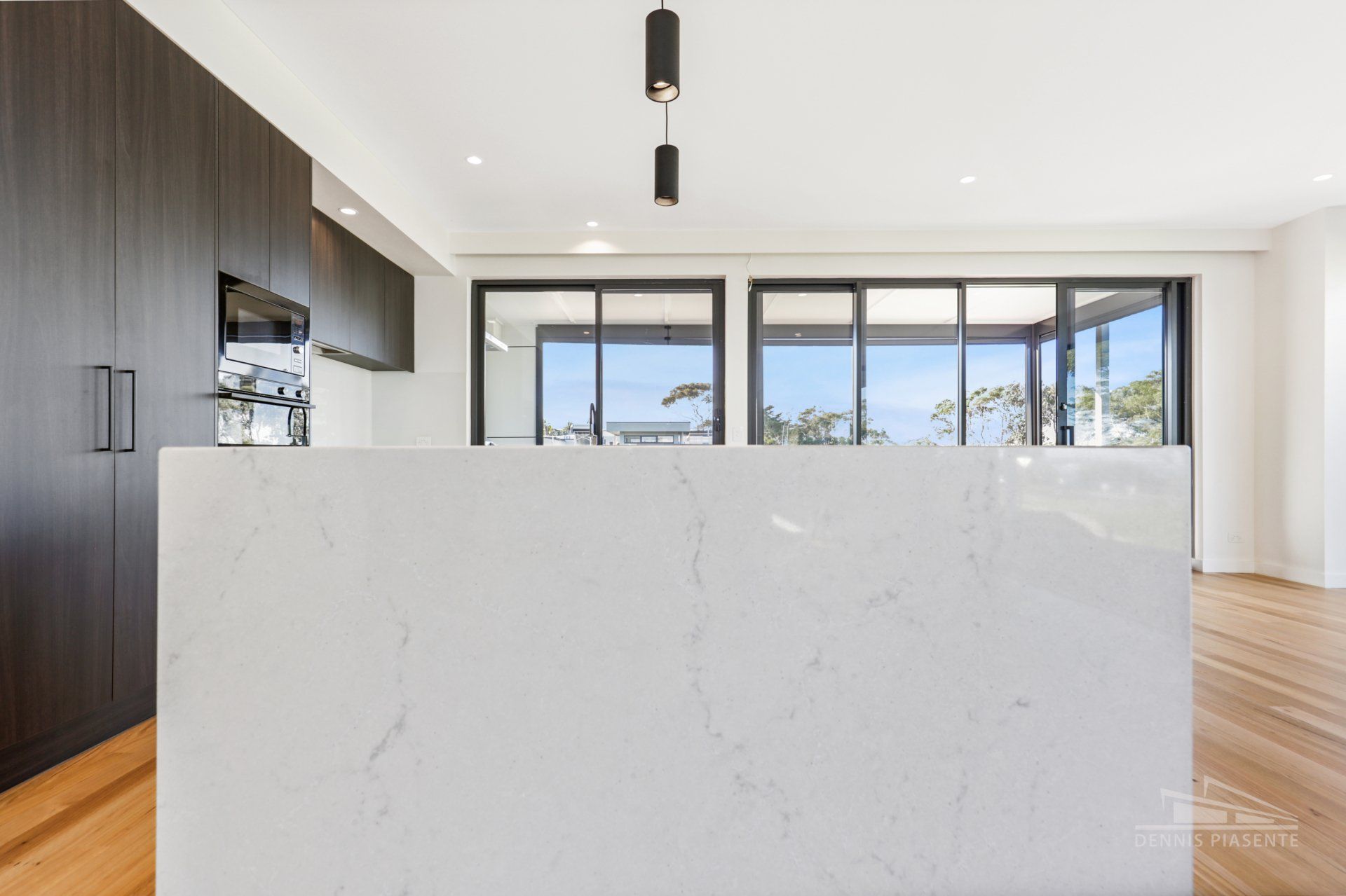 There is a large island in the middle of the kitchen.